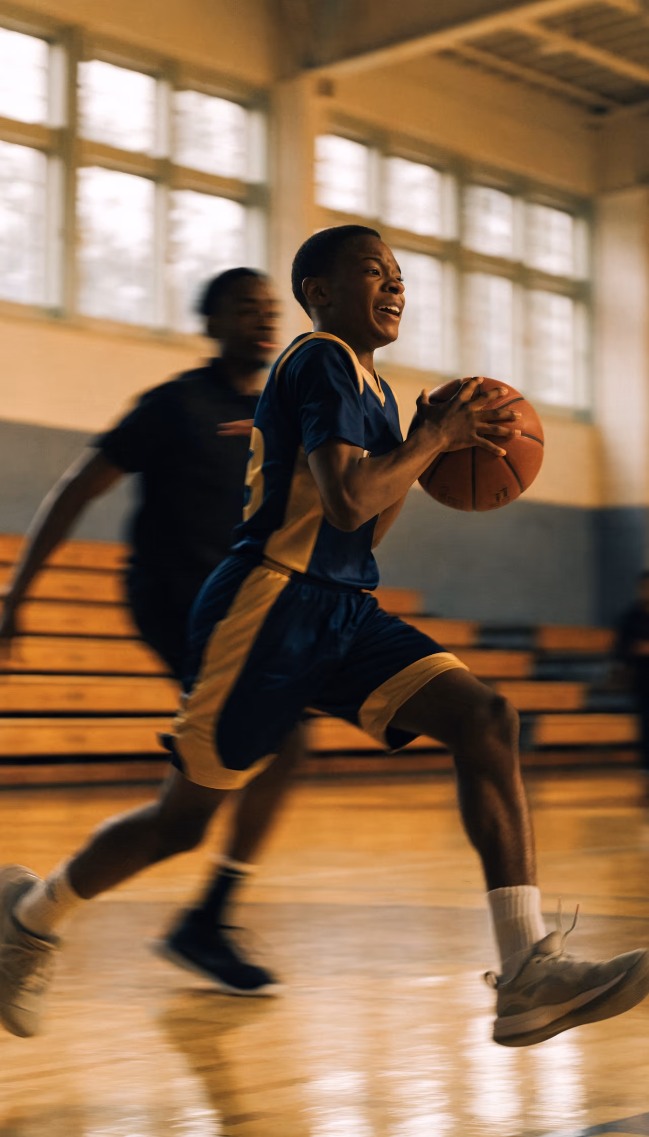 A Hype Reel playing upright on a phone: a young basketball player driving to the basket